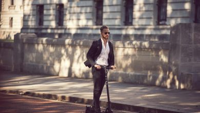 photo of a man on an electric scooter